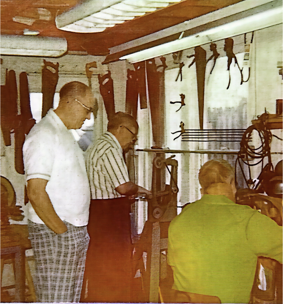 3 men working in the saw shop