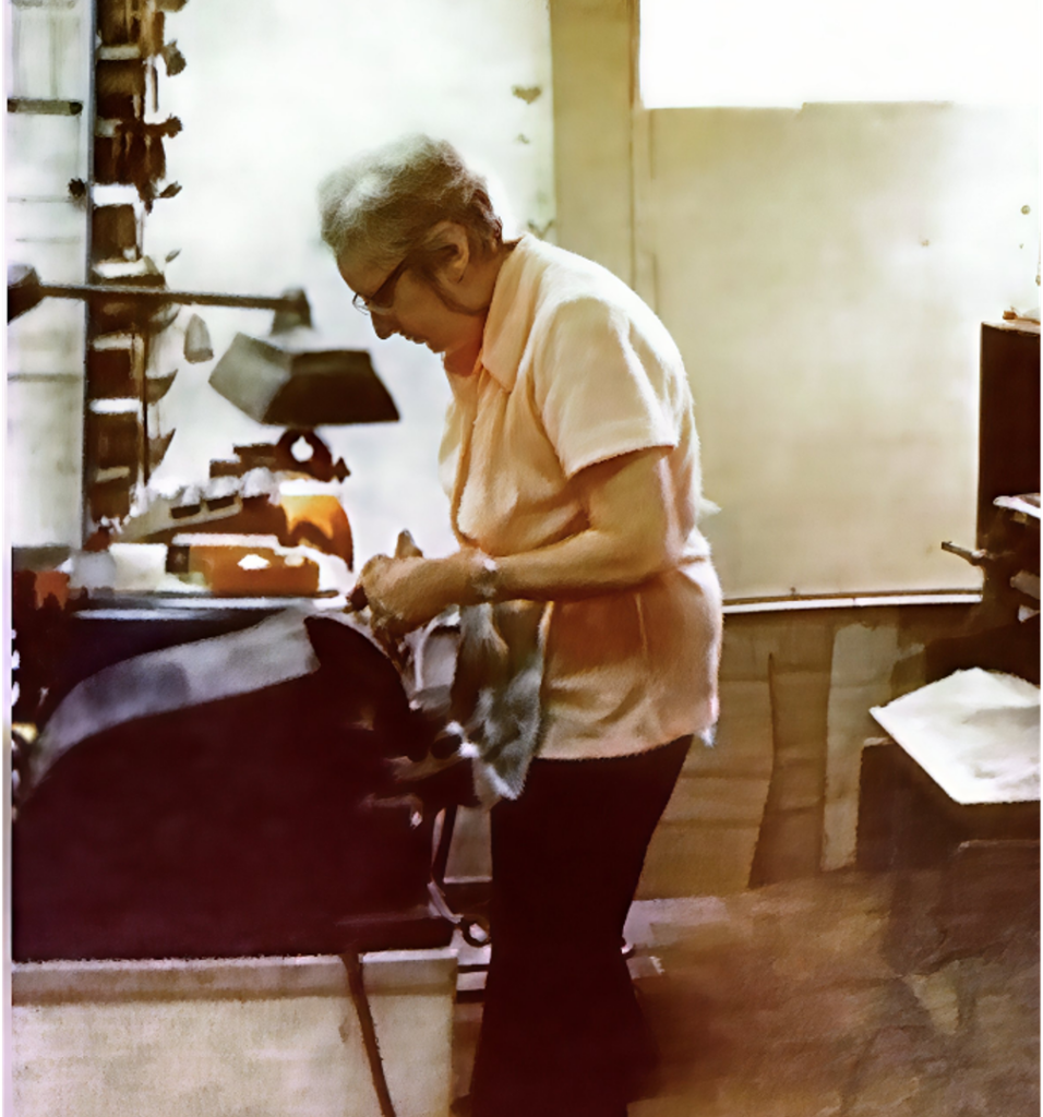 Wanda making a key in the shop
